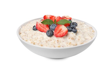 Photo of Tasty boiled oatmeal with berries in bowl isolated on white