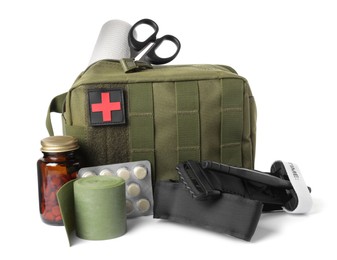 Photo of Military first aid kit, tourniquet, pills and tools on white background