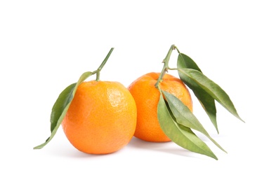 Photo of Tasty ripe tangerines with leaves on white background