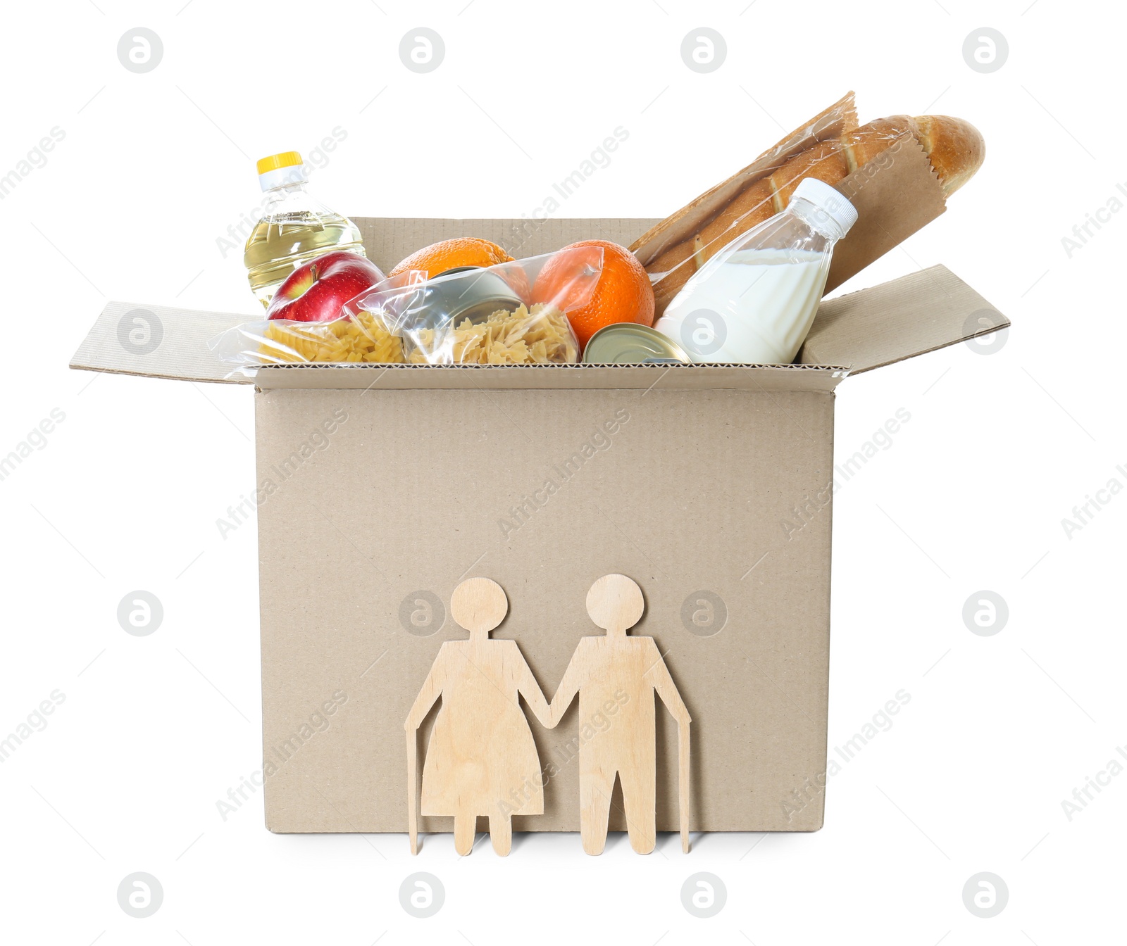 Photo of Humanitarian aid for elderly people. Cardboard box with donation food and wooden figures of couple isolated on white