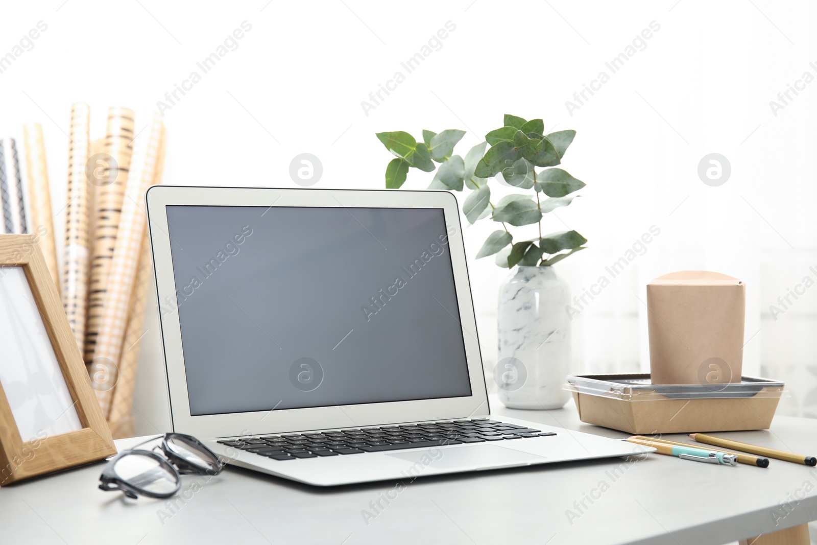 Photo of Cozy blogger workplace with laptop at home