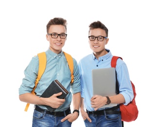 Photo of Teenage twin brothers with glasses on white background