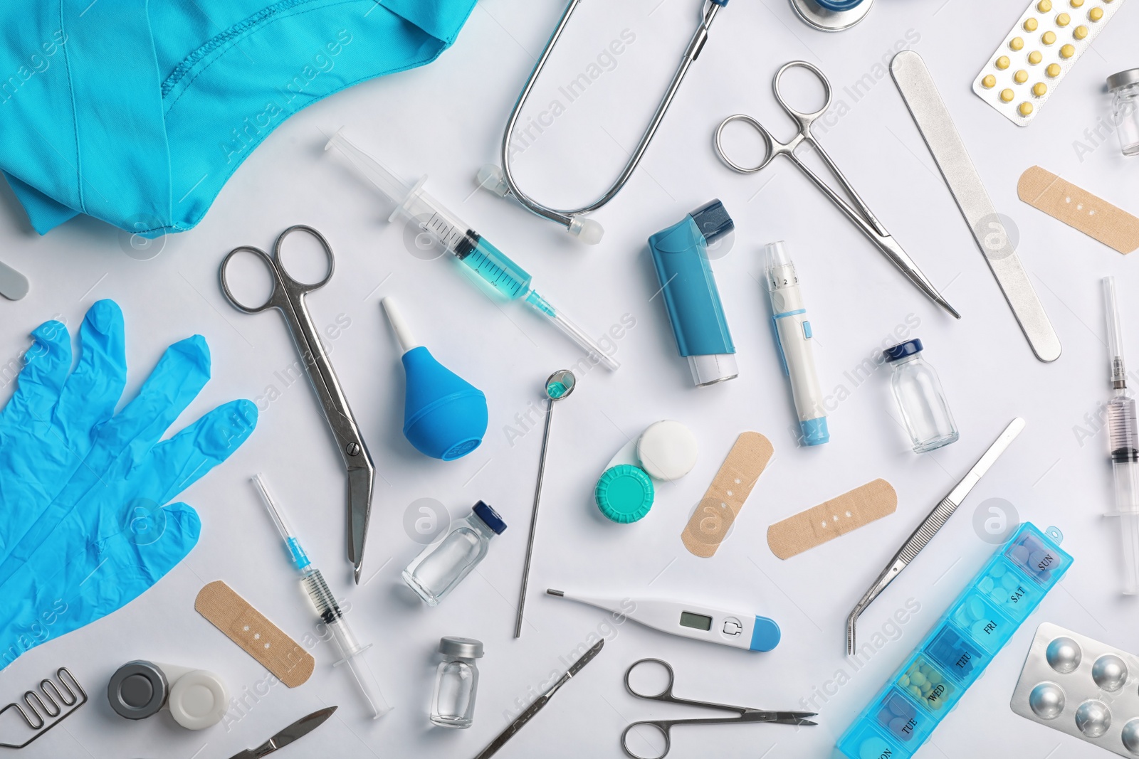 Photo of Many different medical objects on light background, flat lay