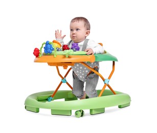 Photo of Portrait of cute little boy in baby walker on white background