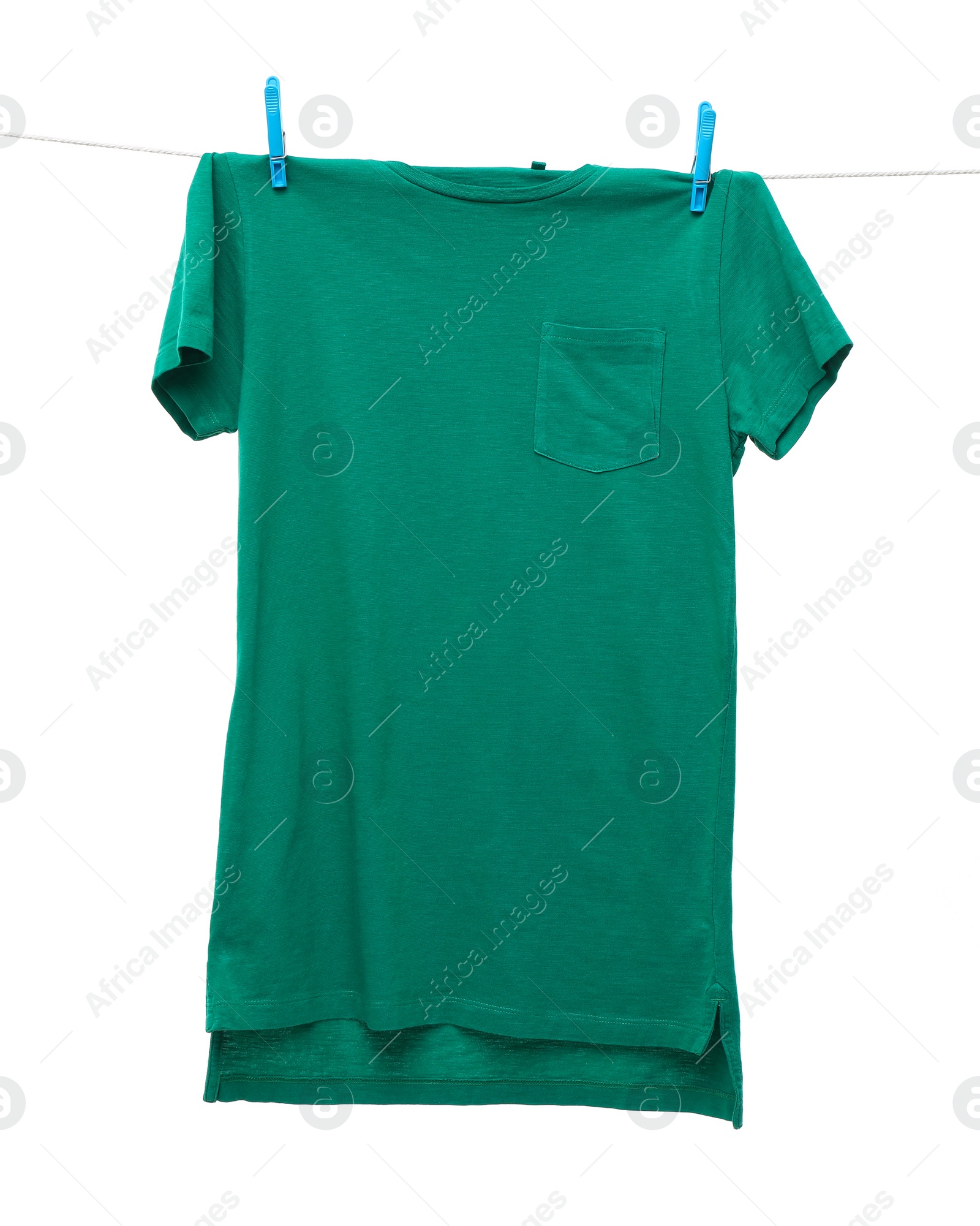 Photo of One green t-shirt drying on washing line isolated on white