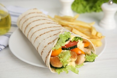 Photo of Delicious shawarma with chicken meat and fresh vegetables served on white wooden table, closeup