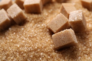 Photo of Different types of brown sugar as background, closeup