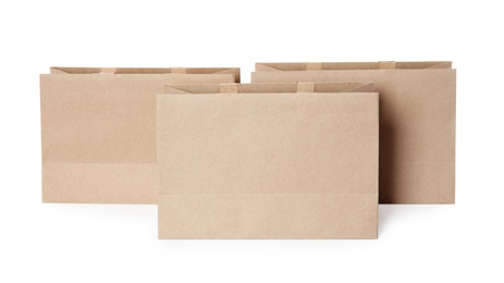 Photo of Paper shopping bags isolated on white. Mock up for design