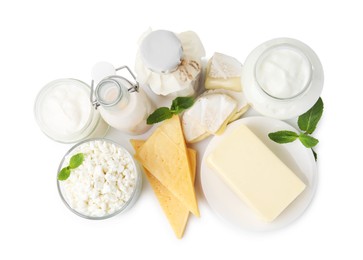 Photo of Different dairy products and mint isolated on white, top view