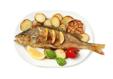Photo of Tasty homemade roasted perch with garnish on white background, top view. River fish