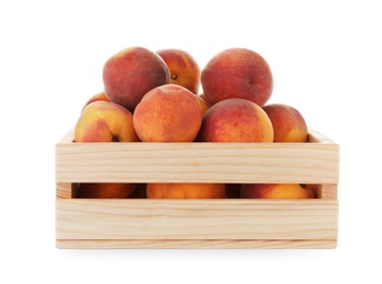 Crate with fresh sweet peaches on white background