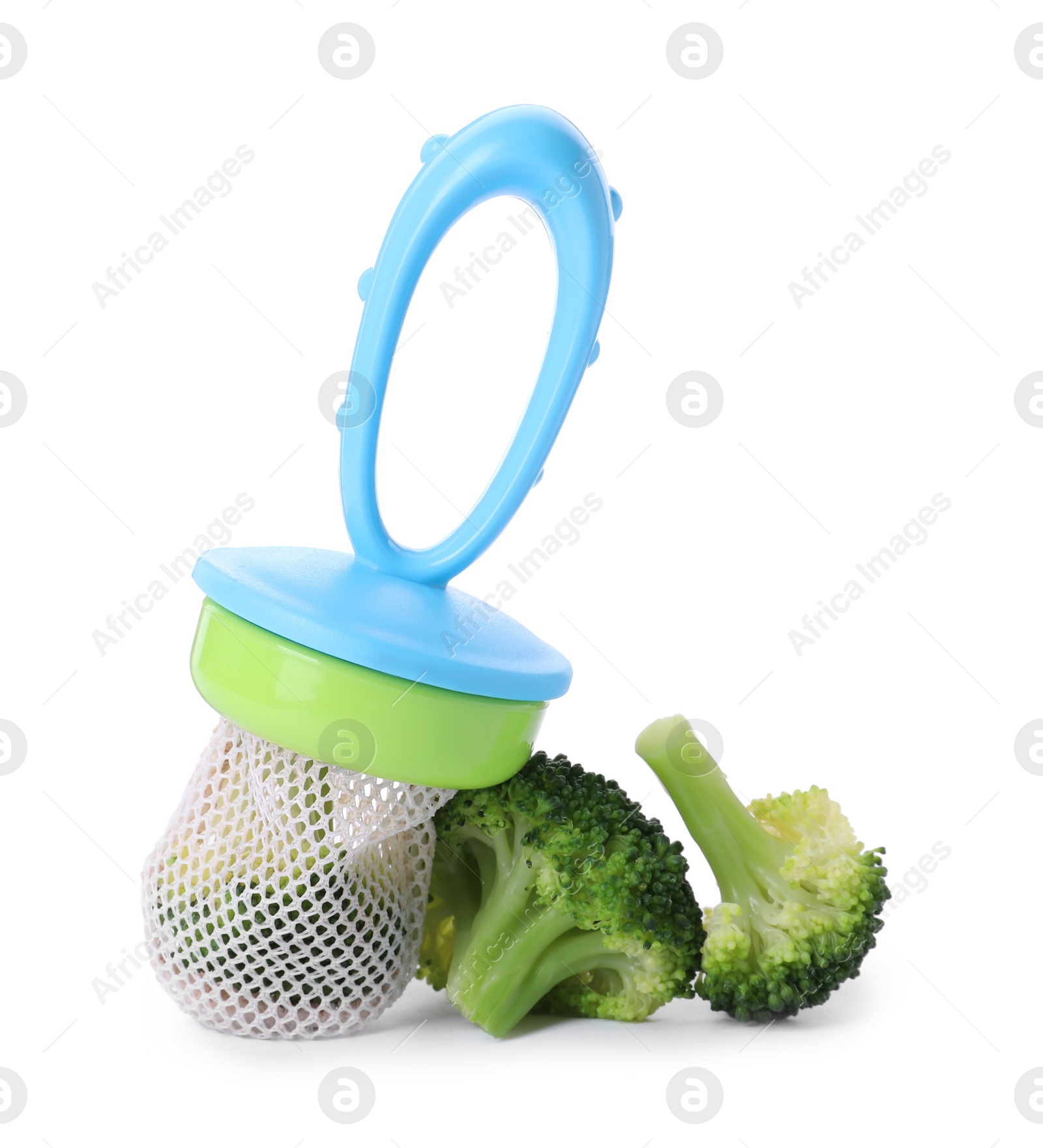 Photo of Nibbler with boiled broccoli on white background. Baby feeder