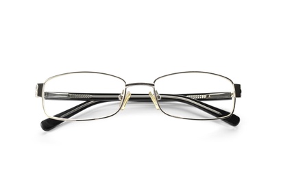 Photo of Glasses with corrective lenses on white background. Vision problem
