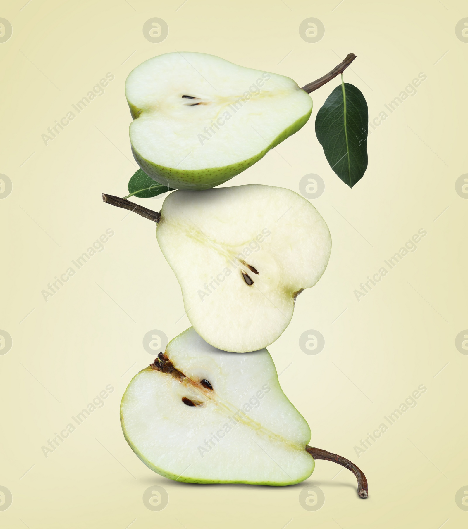 Image of Cut fresh ripe pears on beige background