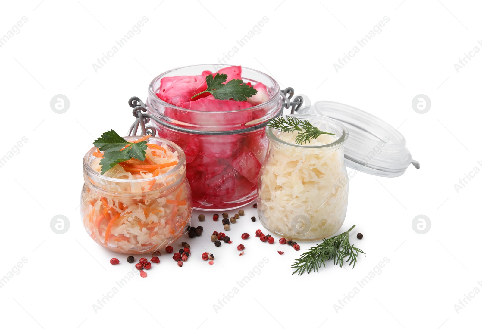 Photo of Delicious sauerkraut prepared according to different recipes and spices on white background