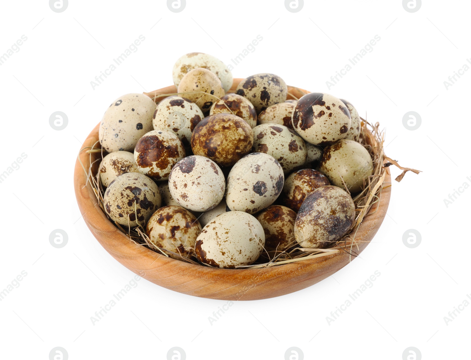 Photo of Wooden bowl with quail eggs and straw isolated on white