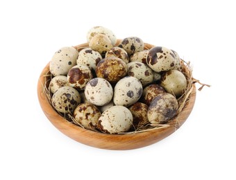 Wooden bowl with quail eggs and straw isolated on white