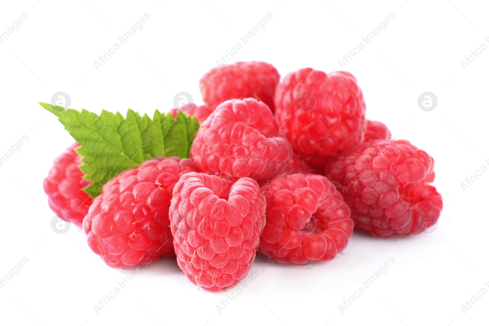 Photo of Pile of fresh ripe raspberries with leaves isolated on white