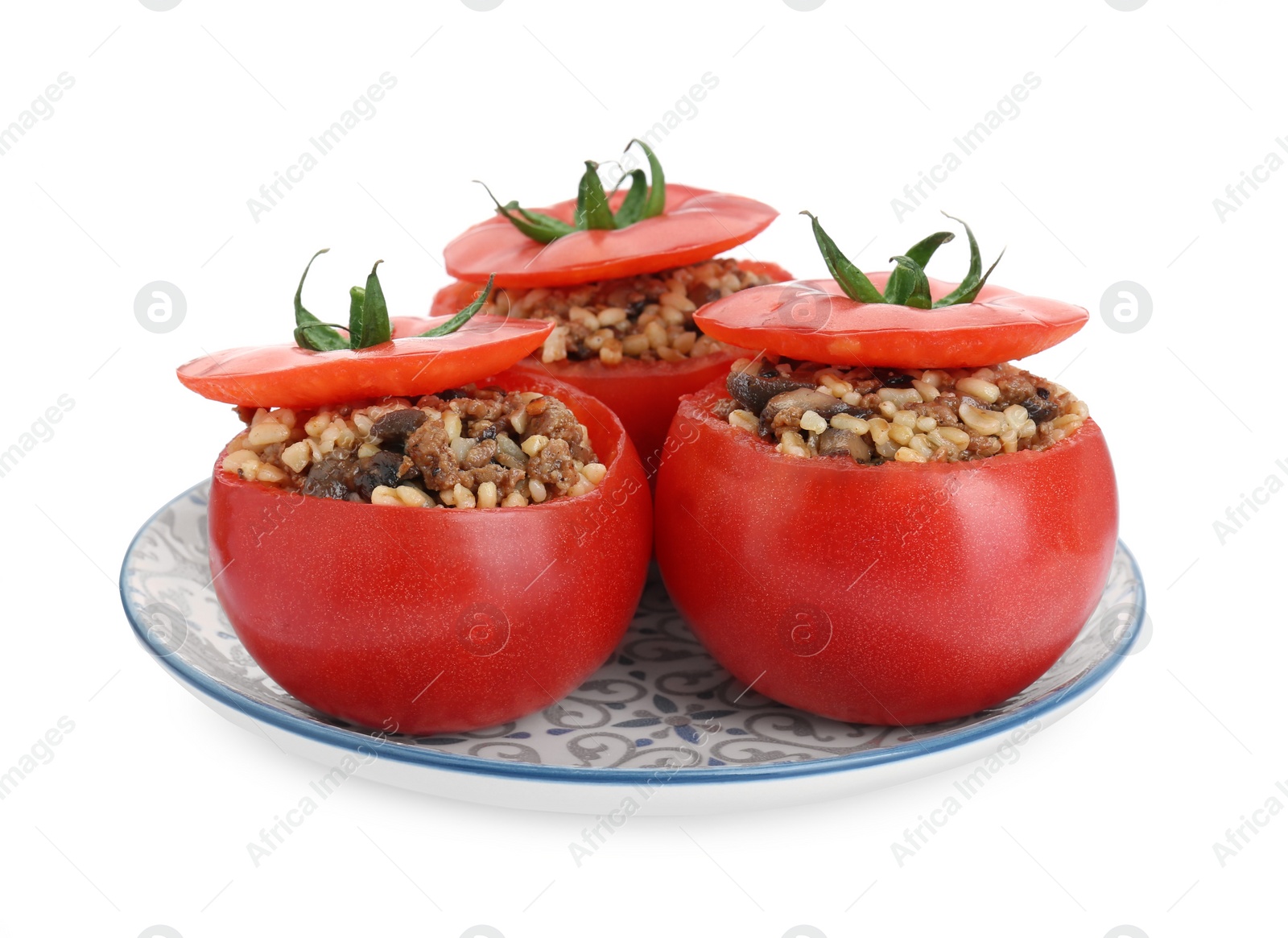 Photo of Delicious stuffed tomatoes with minced beef, bulgur and mushrooms isolated on white