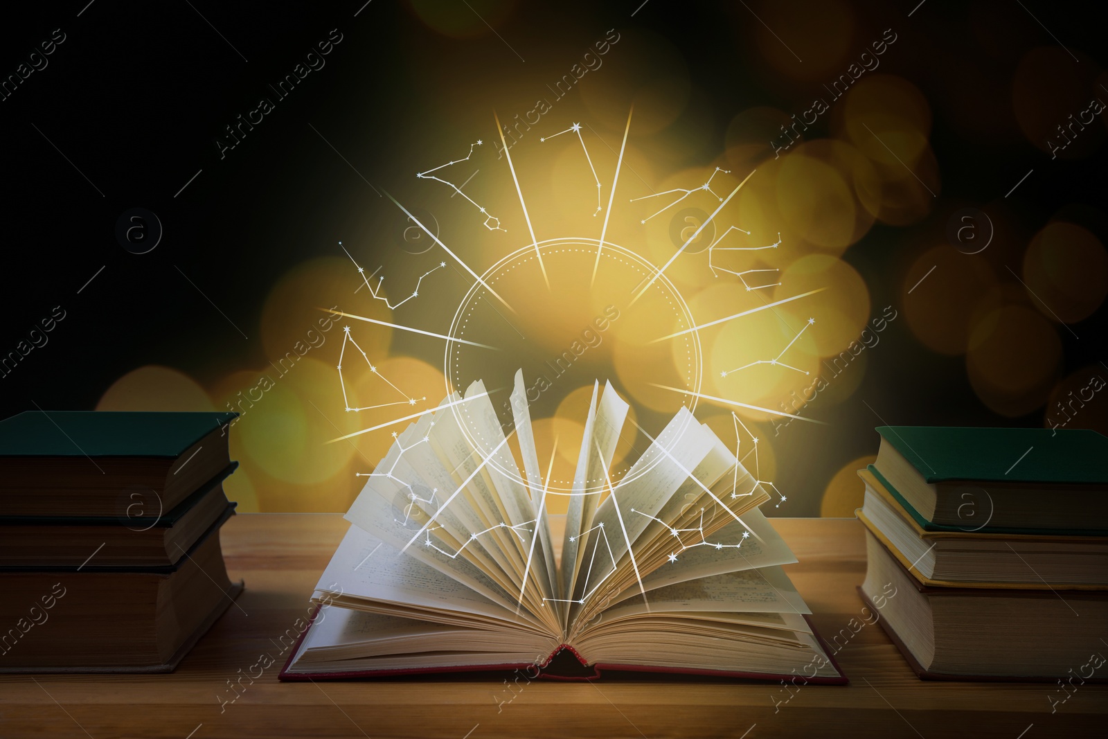 Image of Open book on wooden table and illustration of zodiac wheel with astrological signs