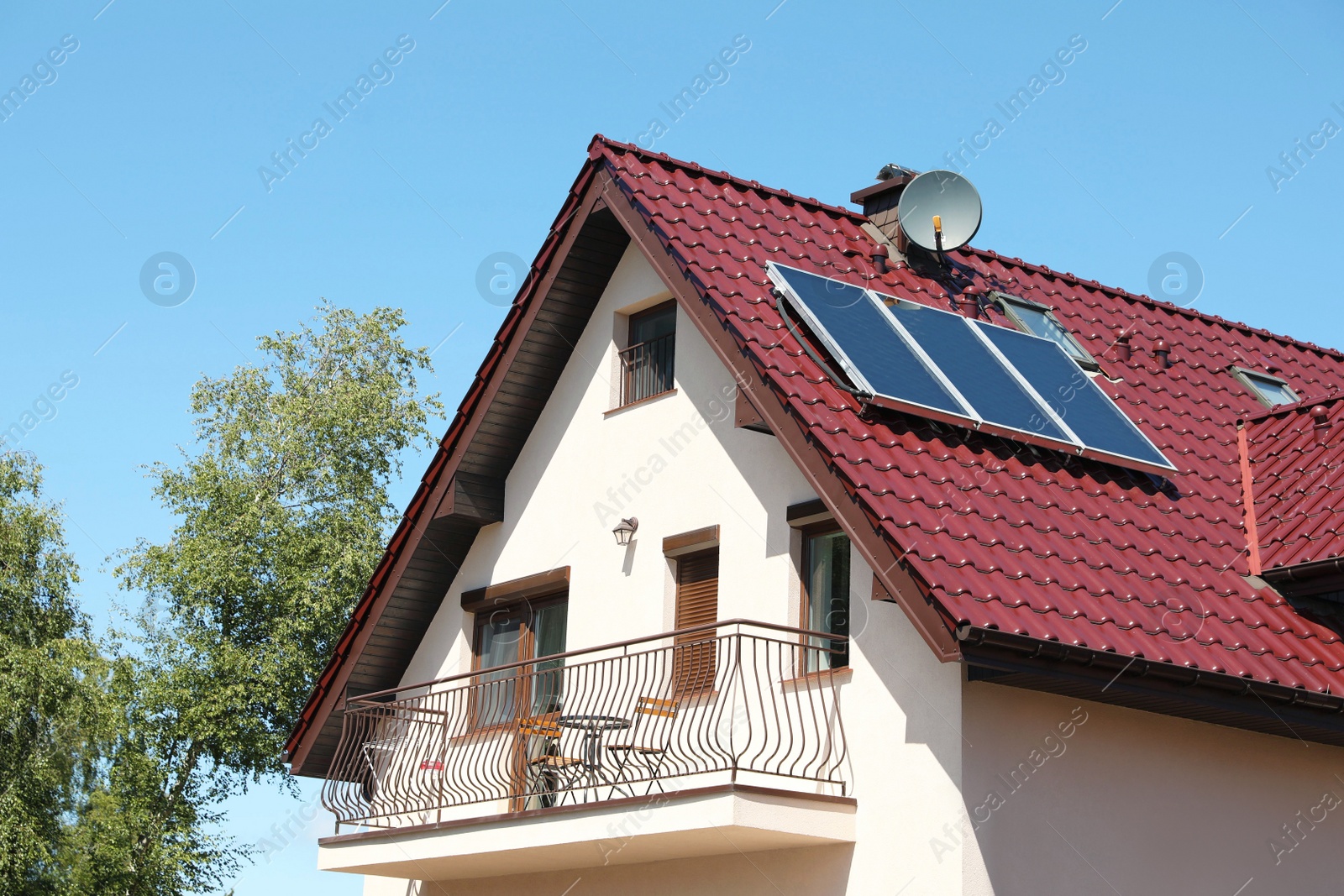 Photo of Exterior of beautiful house with balcony on sunny day