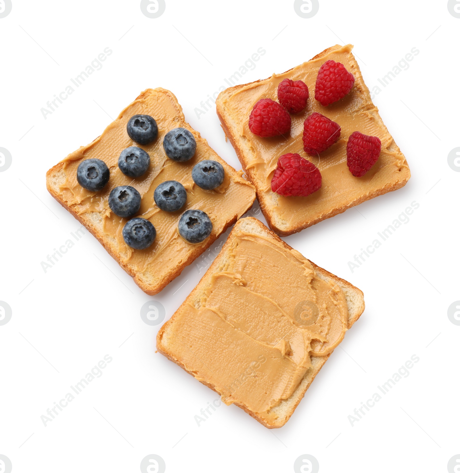 Photo of Tasty peanut butter sandwiches with fresh berries on white background, top view