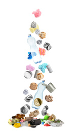 Image of Different garbage falling into pile on white background. Waste management and recycling