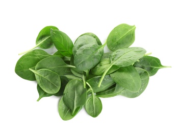 Pile of fresh green healthy baby spinach leaves on white background, top view