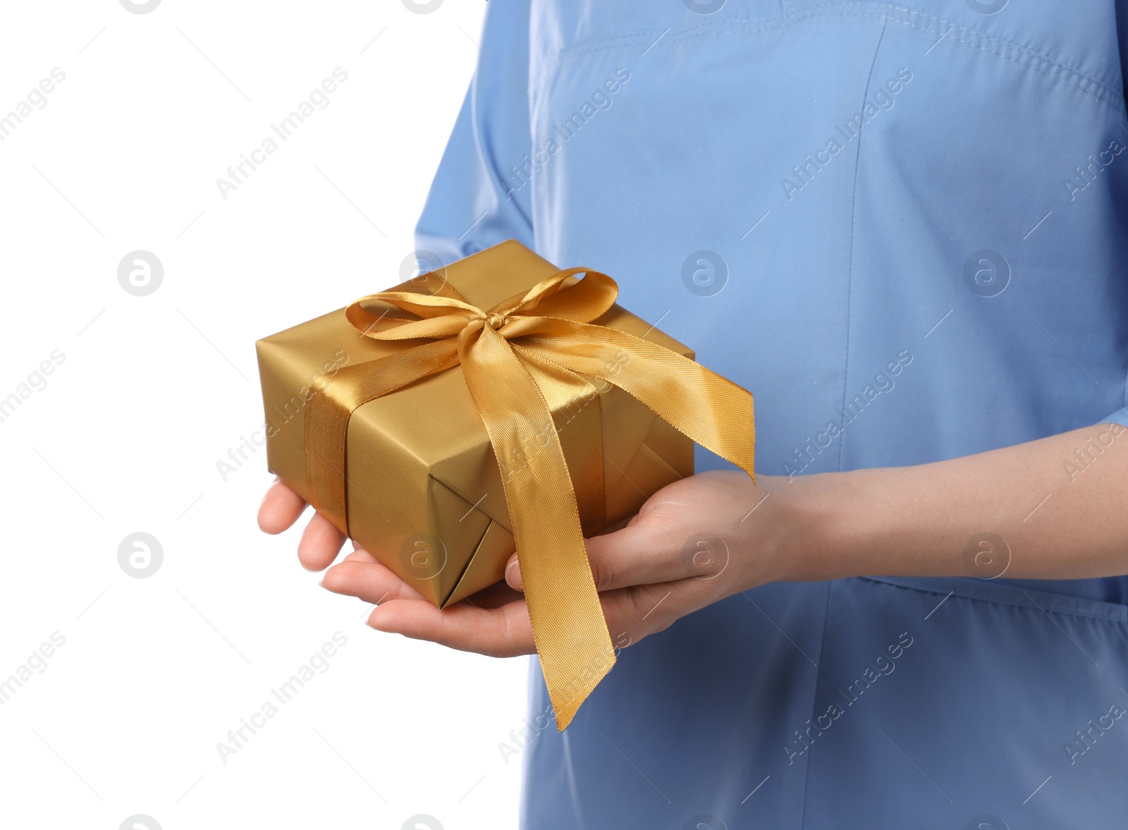 Photo of Doctor holding gift box on white background, closeup. Medical present