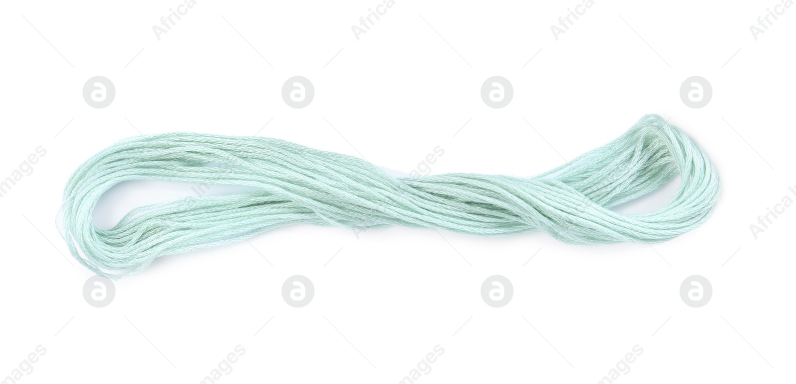 Photo of Light pastel blue embroidery thread on white background