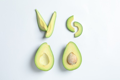 Photo of Composition with ripe fresh avocados on white background