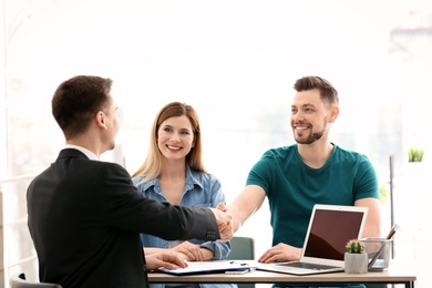 Young couple meeting with consultant in office