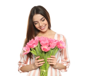 Photo of Portrait of smiling young girl with beautiful tulips on white background. International Women's Day