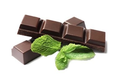 Photo of Pieces of dark chocolate with mint on white background