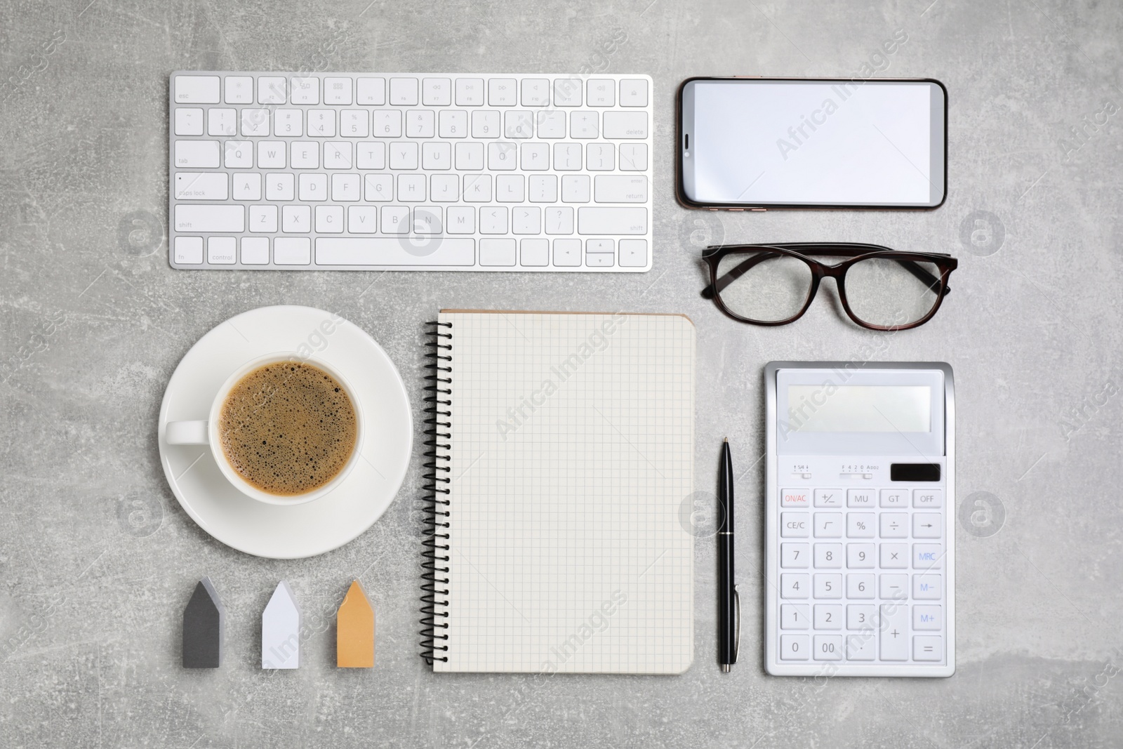 Photo of Flat lay composition with computer keyboard, calculator and notebook on grey table