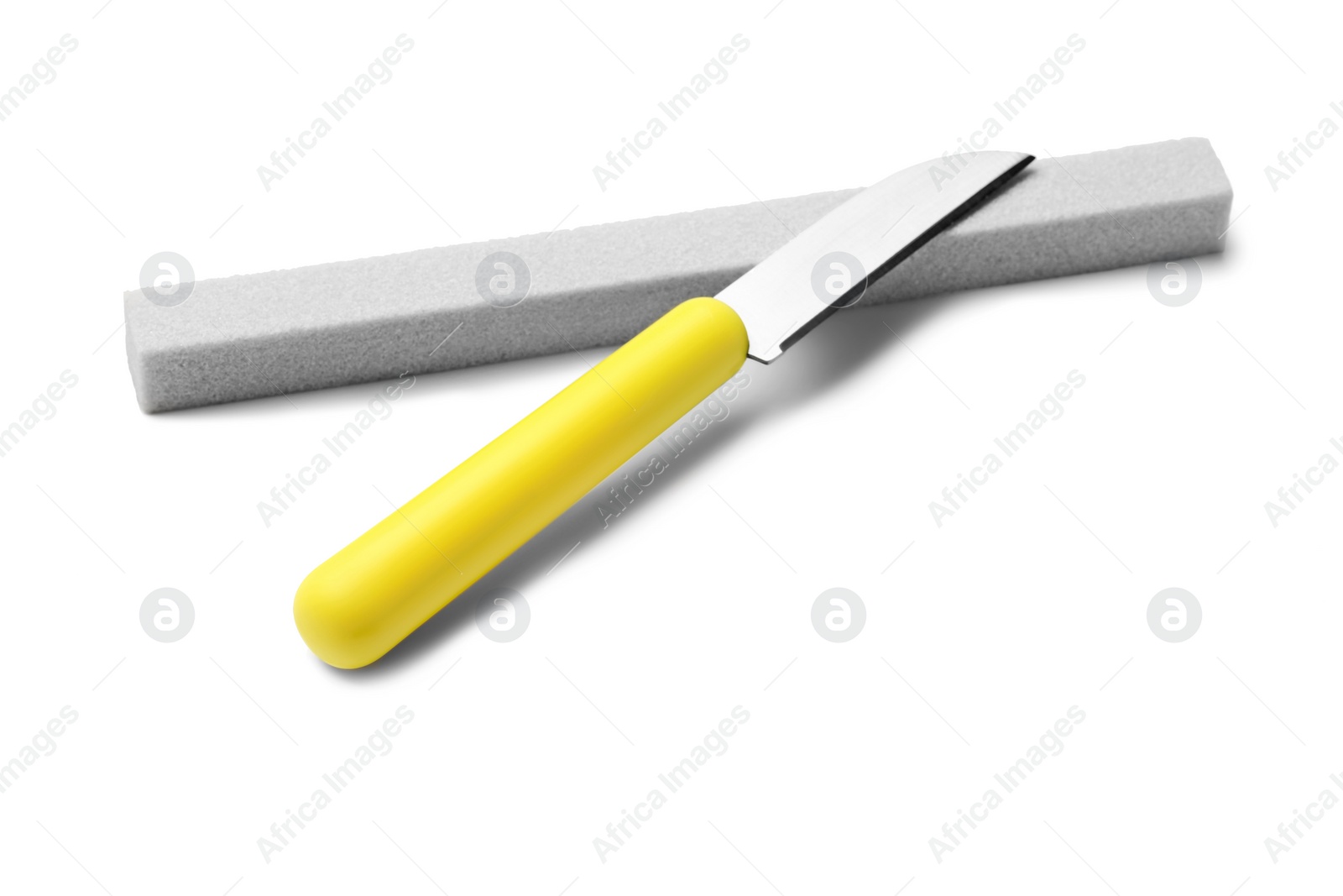 Photo of Sharp paring knife with grindstone isolated on white