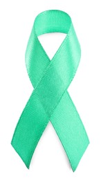 Green ribbon isolated on white, top view. World Cancer Day