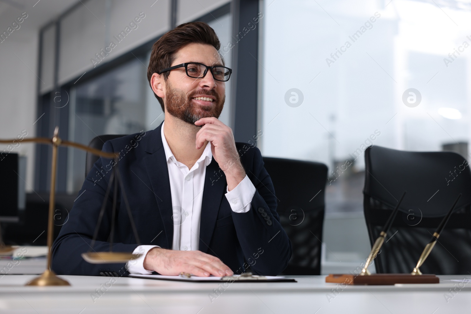Photo of Smiling lawyer at table in office, space for text