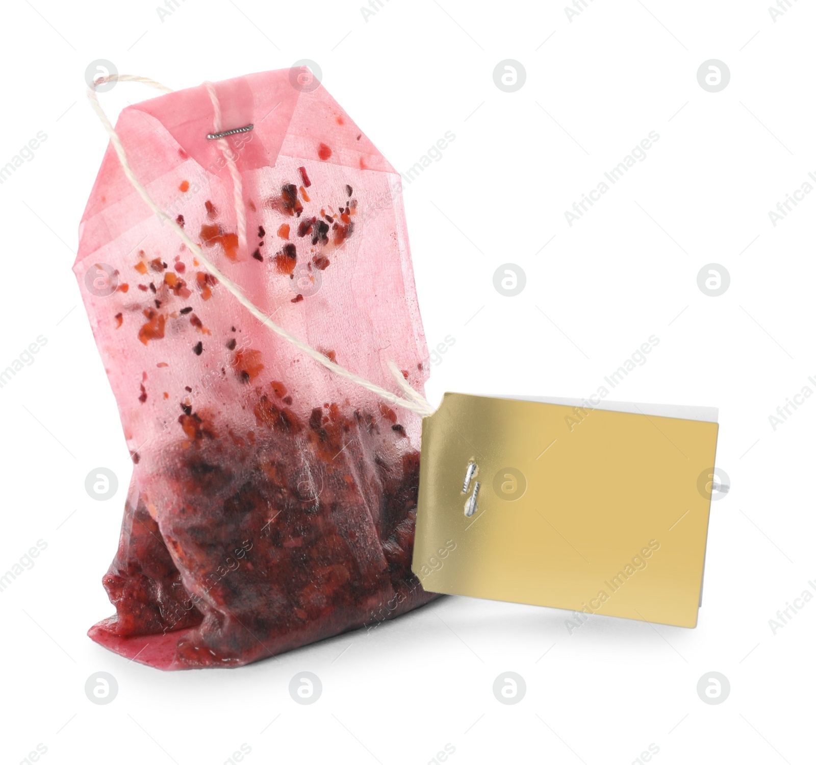 Photo of Used tea bag with tag on white background