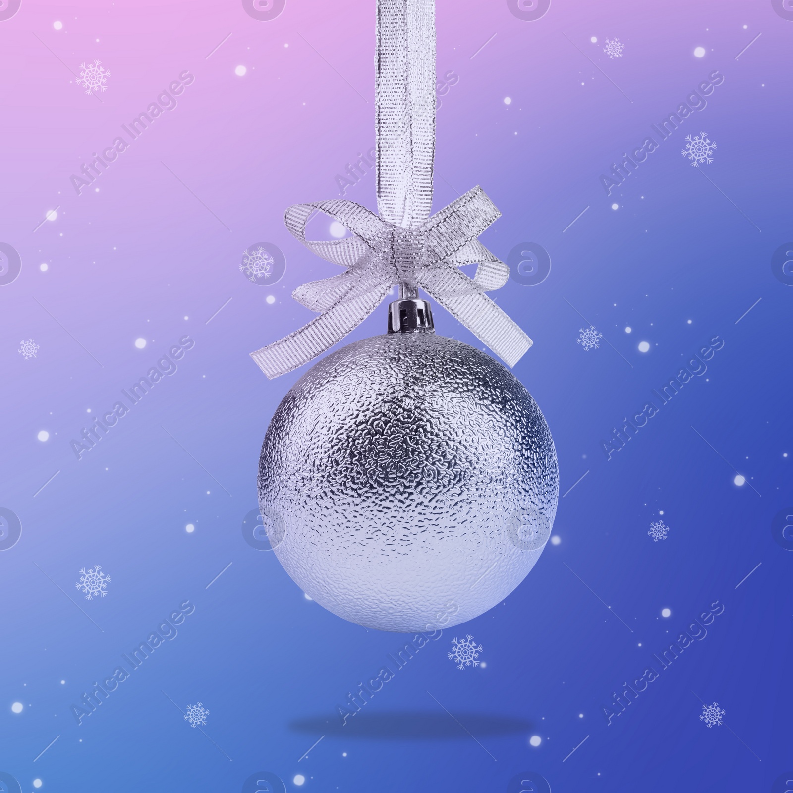 Image of Beautiful silver Christmas ball with bow and snowflakes on color background