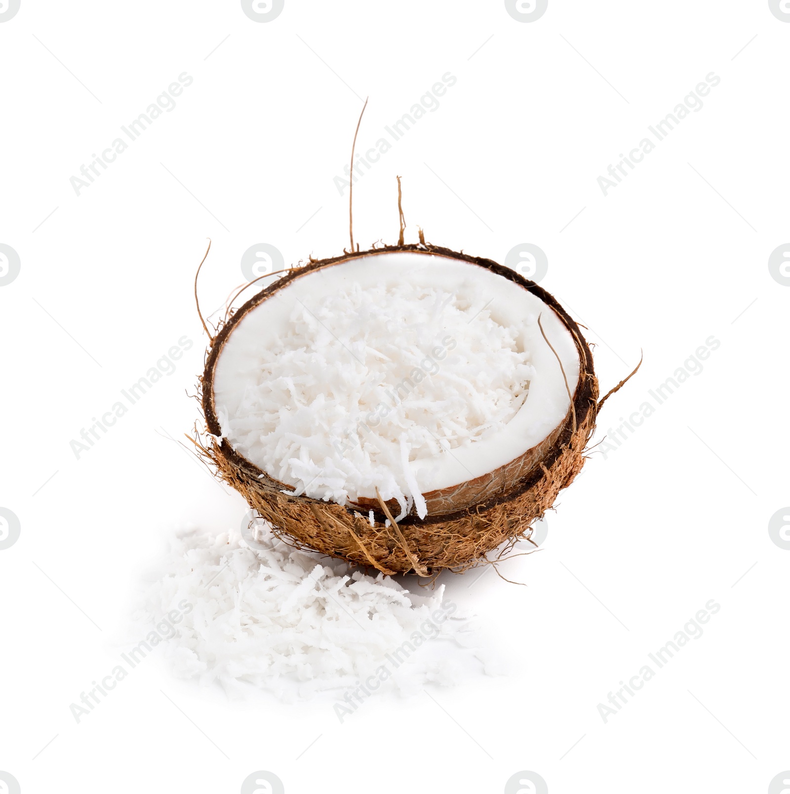 Photo of Coconut flakes in nut shell isolated on white