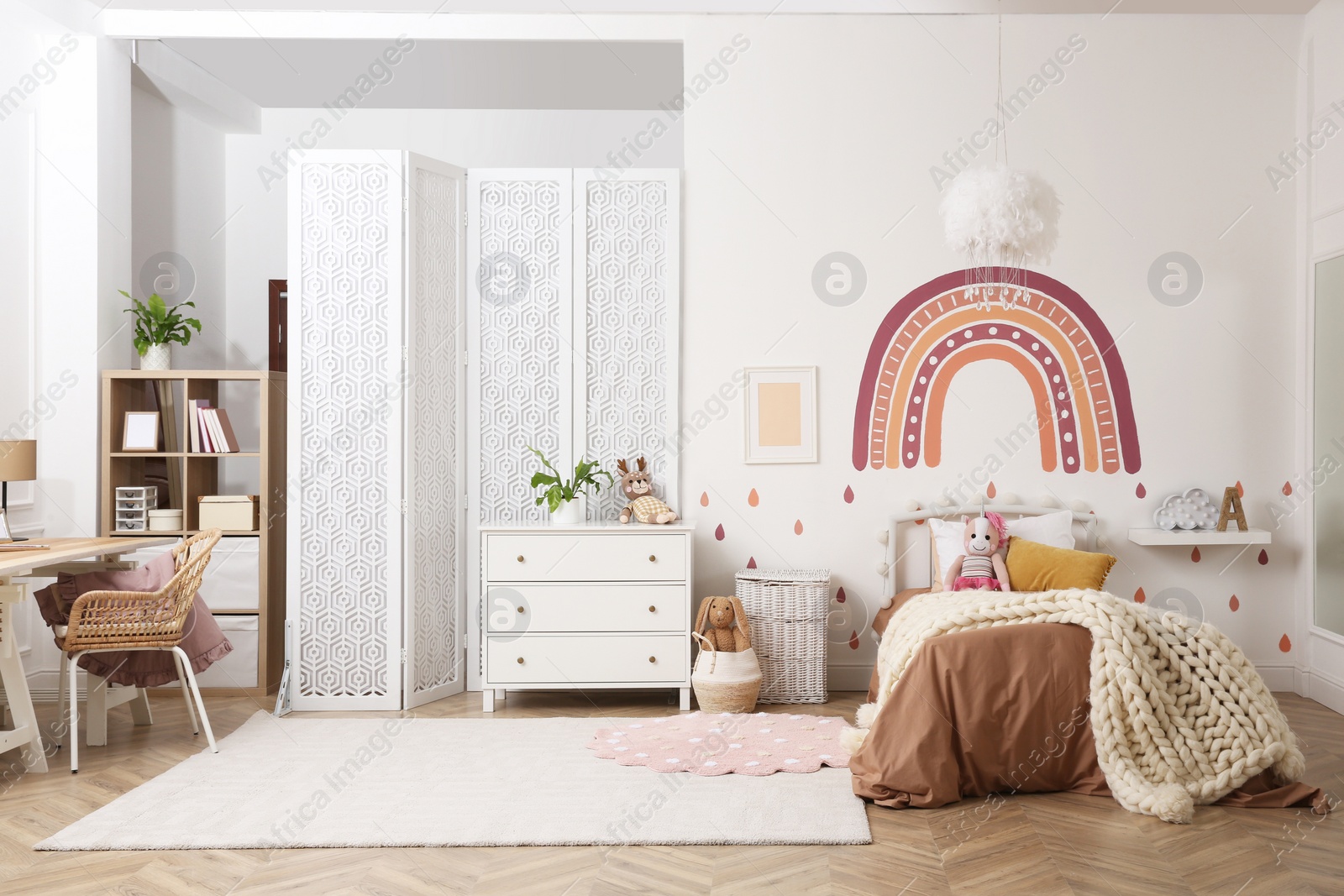 Photo of Stylish room with comfortable bed for kids. Interior design