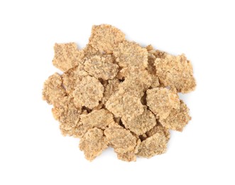 Photo of Pile of bran flakes on white background, top view. Healthy breakfast cereal