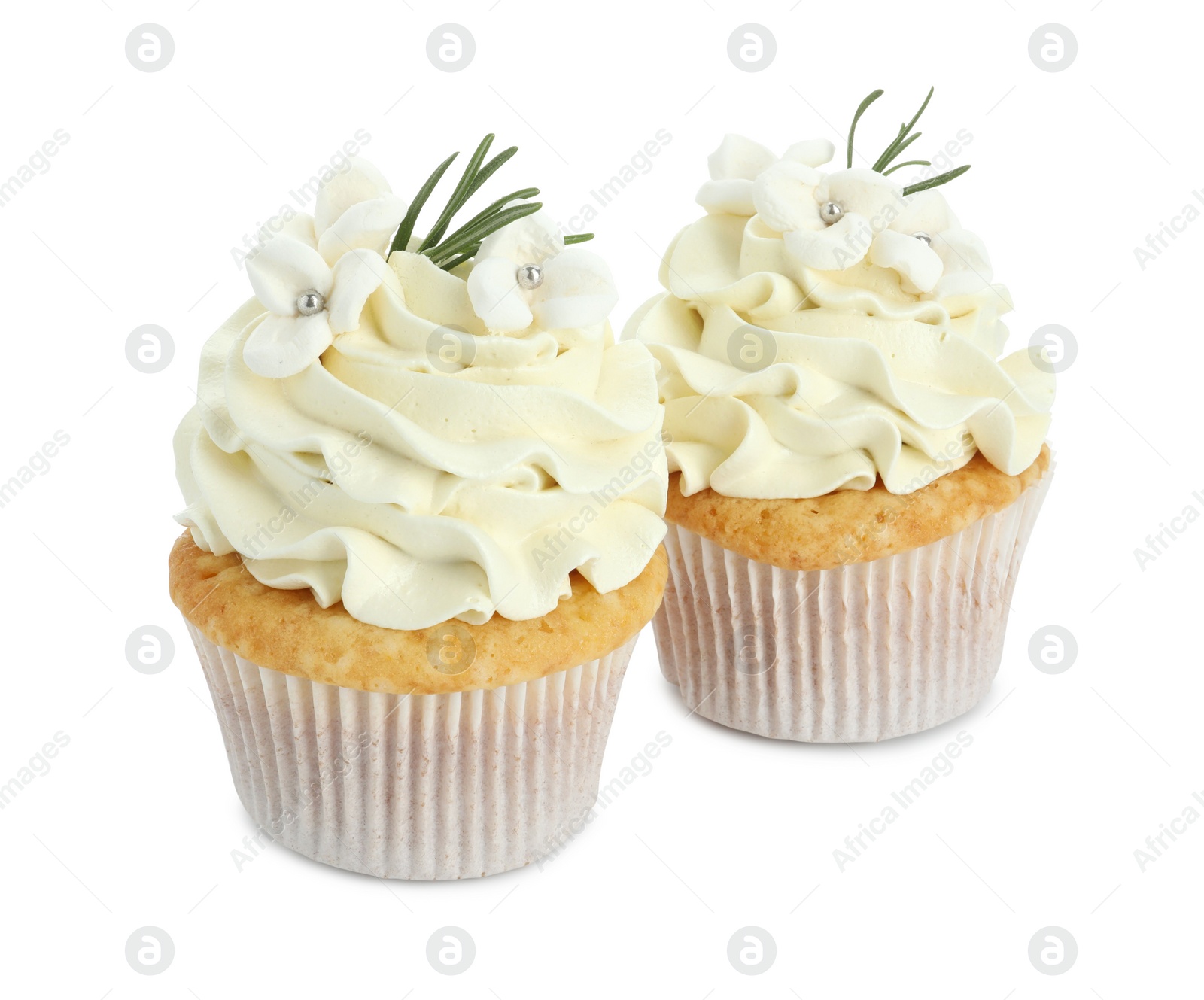 Photo of Tasty Easter cupcakes with vanilla cream isolated on white