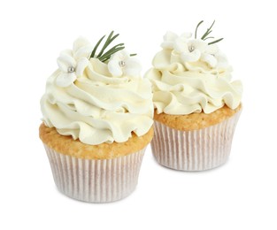 Tasty Easter cupcakes with vanilla cream isolated on white