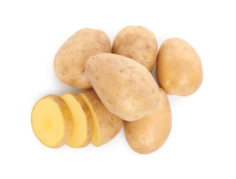 Photo of Whole and cut fresh potatoes on white background, top view