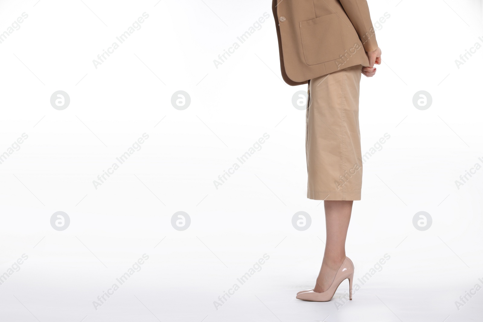 Photo of Businesswoman in beige shoes on white background, closeup