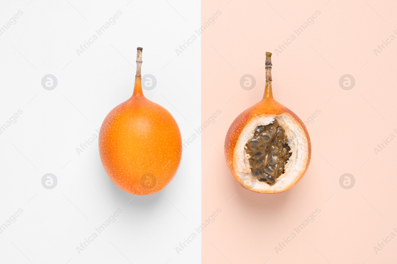 Photo of Delicious ripe granadillas on color background, flat lay