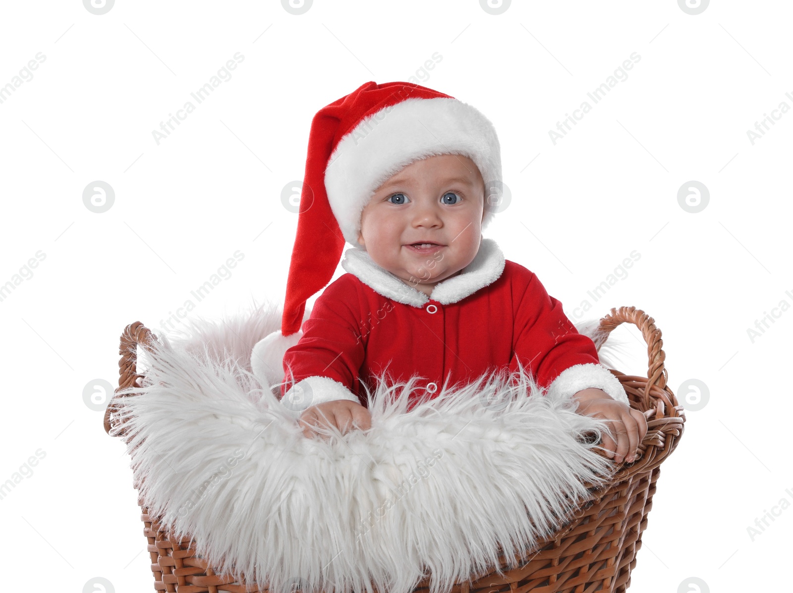 Photo of Cute baby in wicker basket on white background. Christmas celebration