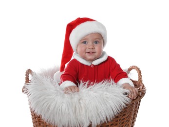 Cute baby in wicker basket on white background. Christmas celebration
